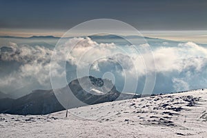 Snowy Great Fatra peaks and slopes in Slovakia in morning mist