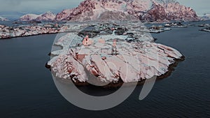Snowy Haven: A Drone's Sunset Exploration of Henningsvaer, Norway