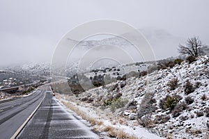 Snowy highway through Arizona Desert in Winter