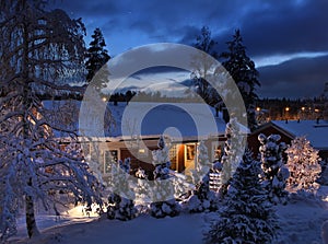 Snowy house on Christmas evening