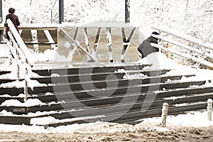 Snowy and icy stairs in front deli