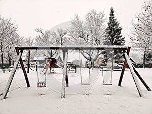 Snowy kids playground at public park
