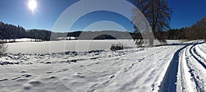 Snowy landscape and pond in South Bohemia