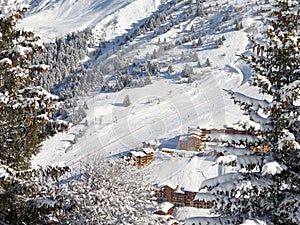 Snowy landscape with ski chalets, Meribel, the Alps