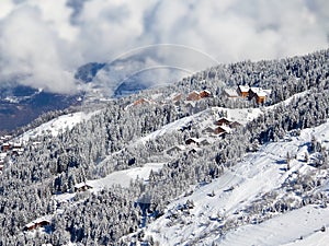 Snowy landscape with ski chalets, Meribel, the Alps