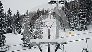 Snowy landscape slow motion from chair lift pov Dolomites