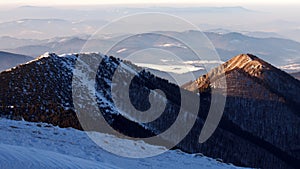 Snowy landscape view of hills from national park Mala Fatra.