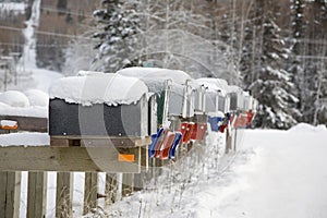 Snowy mail boxes all in row