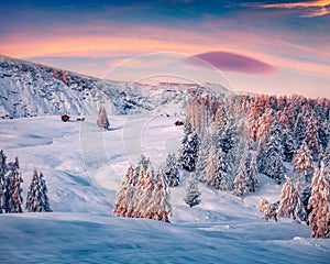 Snowy morning view of Alpe di Siusi village.