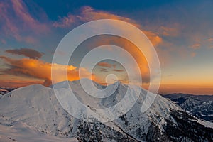 Snowy mountain with clouds photo