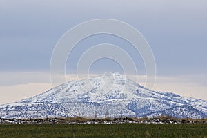 Snowy Mountain With Green Fields