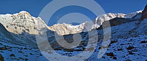 Snowy Mountain Landscape Panorama in Himalaya. Sunrise Annapurna South peak, Annapurna Base Camp Track.