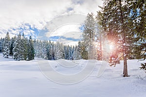 Snowy mountain landscape at sunset in winter