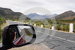 Snowy mountain peaks in the Breede Valley, Worcester, South Africa, captured from a moving car