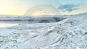 Snowy mountain range, Aerial view nature landscape in Iceland, Snow covered sharp mountain peaks, Icelandic highlands in