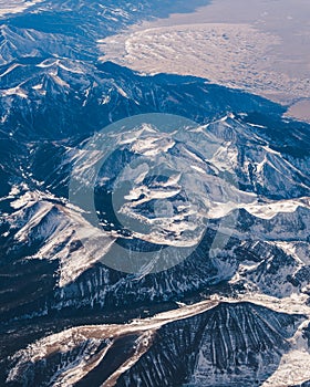 Snowy mountain range from plane