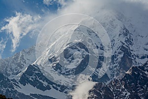 Snowy mountain range surrounded by clouds at Mardi Himal trek