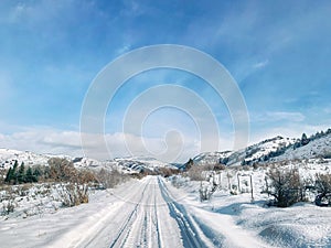 A snowy mountain. Road