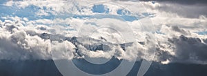 Snowy mountain Untersberg with clouds, snow and blue sky, Austria