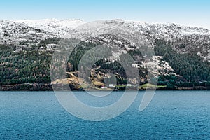 Snowy mountains along the coastline of Norway, Scandinavia.