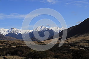 The snowy mountains in the distance