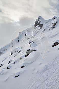 Snowy mountains with falling snow