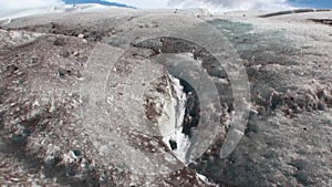 Snowy mountains panorama icebergs on background of clouds in Antarctica.