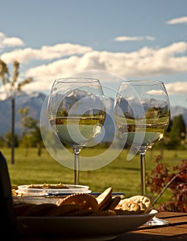 Snowy Mountains Seen Through Wine Glasses photo