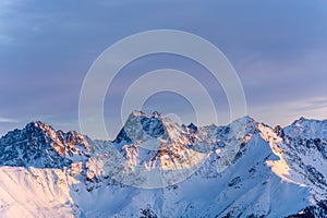 Snowy mountains during sunset in the alps