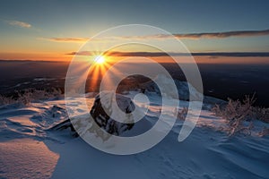 snowy mountaintop with sunrise, the sun peeking over the horizon