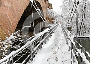 Snowy Nuremberg, Germany- iron bridge ( Kettensteg), old town city walls