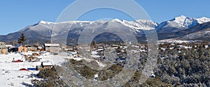 Snowy panorama of town of Truchas, NM and Sangre de Cristo Mountains photo