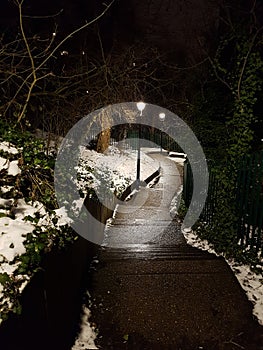 Snowy path at night time