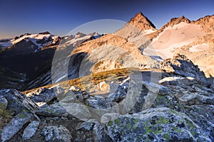 Snowy peak and background rocks