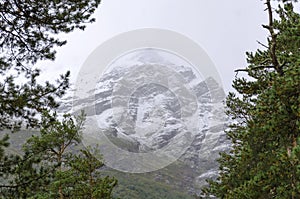 Snowy peak of the Caucasus mountain in autumn