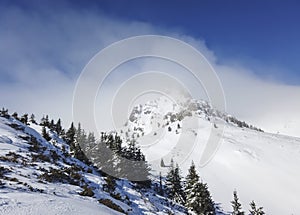 Snowy peaks in Ciucas mountains , Romania