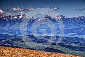 Snowy peaks and green hills in Western Tatras, Liptov, Slovakia