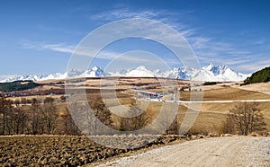 Snowy peaks of High Tatras mountains and landsccape.