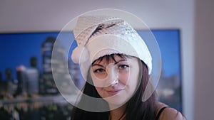 Snowy Playfulness: Woman in Snow Maiden Hat Playfully Flirting with the Camera