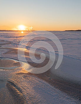 On the snowy riverbank landscape. Winter snow scene. Winter river in snow