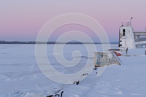 On the snowy riverbank landscape. Winter snow scene. Winter river in snow