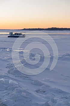 On the snowy riverbank landscape. Winter snow scene. Winter river in snow