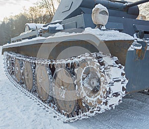 On a snowy road moving German tank of the second world war