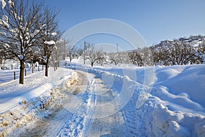 Snowy road. Piedmont, Italy.