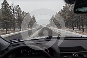 Snowy roadway through window