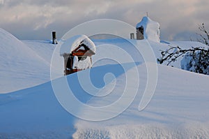 Snowy roof and chimney