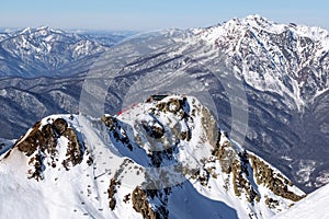 Snowy ski slopes and chair cableway lifts in Sochi Krasnaya Polyana winter mountain resort beautiful scenery