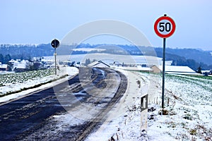 snowy, slippery road into Welling, Eifel in winter photo