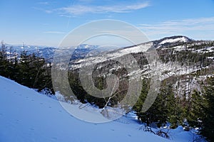 Snowy slope at Silesian Beskid mountains near European Bialy Krzyz in Poland