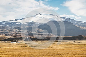 Snowy Snaefellsjokull volcano summit. Iceland volcano landscape with white glacier cap